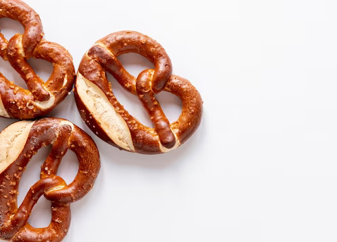 Top view of pretzels on white background