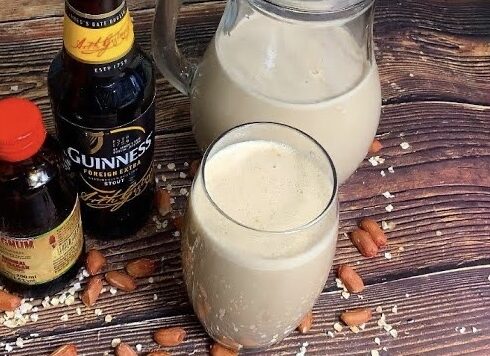 Drink on wooden table with nuts